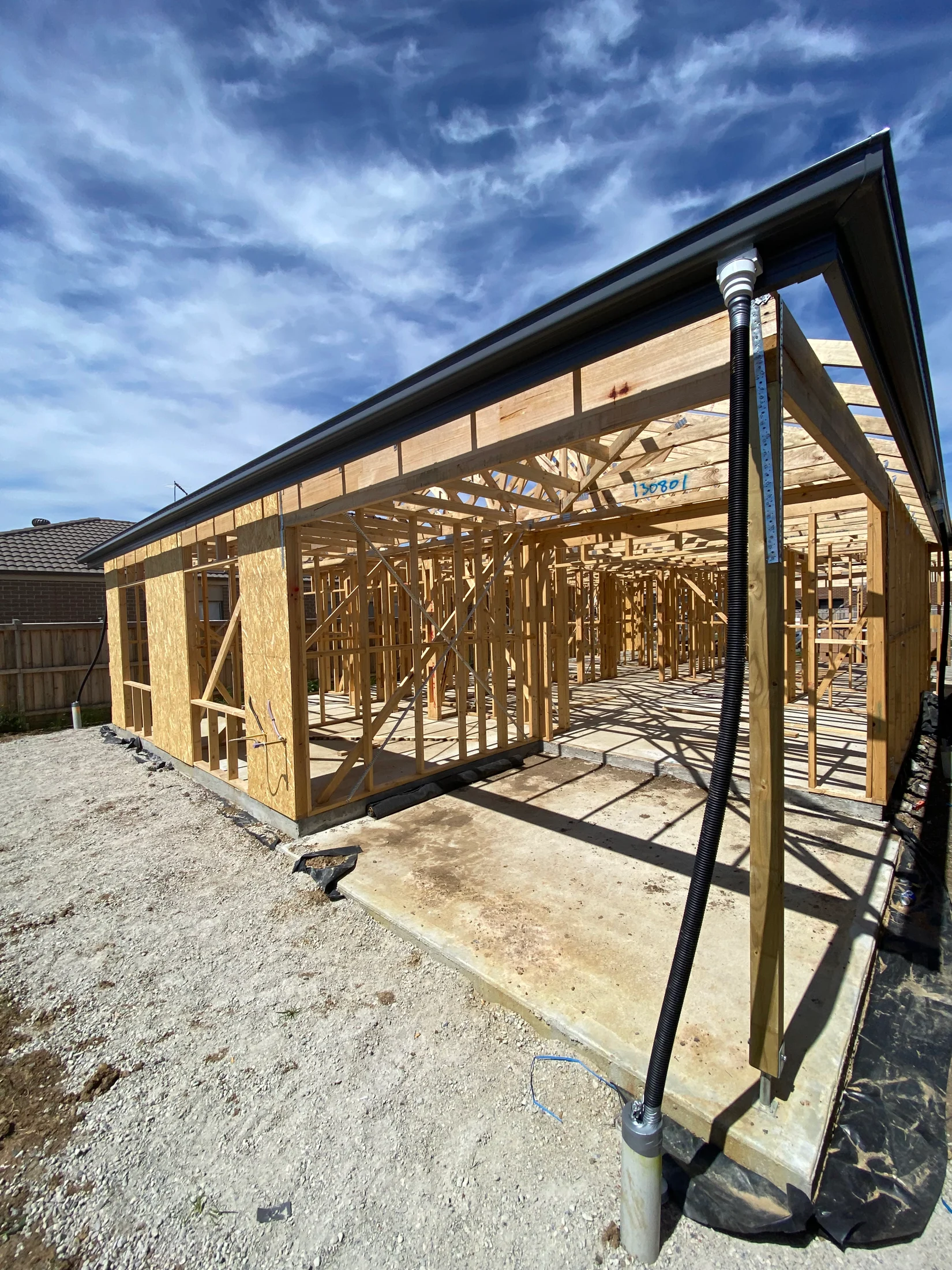 Timber framing, roof framing and guttering visible during a new home’s construction